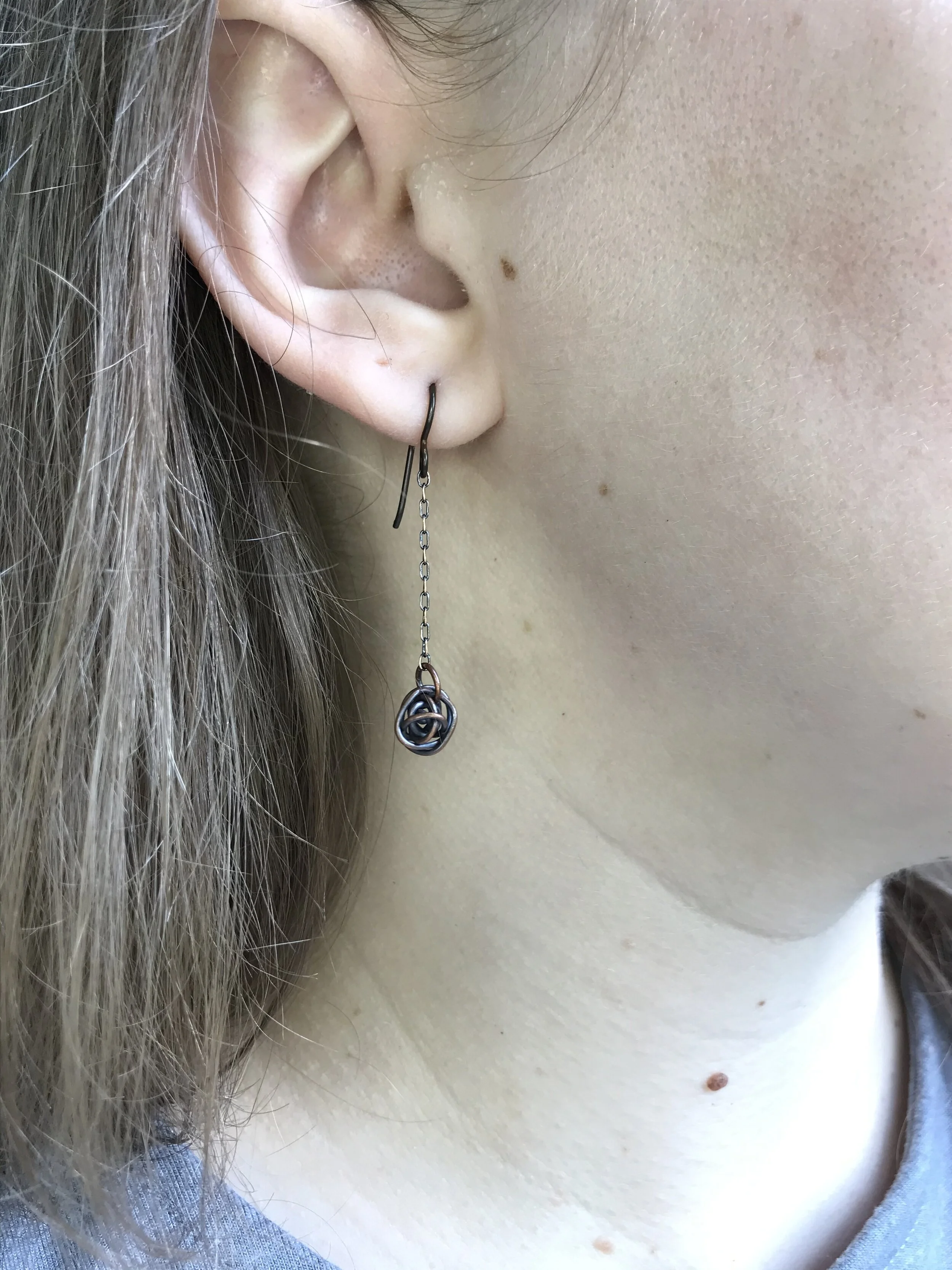 Tiny Scribbles antique copper earrings with dangle chain on model