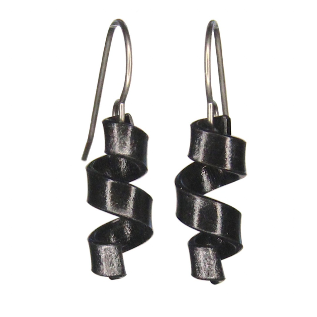 Earrings are a strip of colorful anodized aluminum twisted into a corkscrew curl shape. Black option shown. Earring wires are gray French hooks.