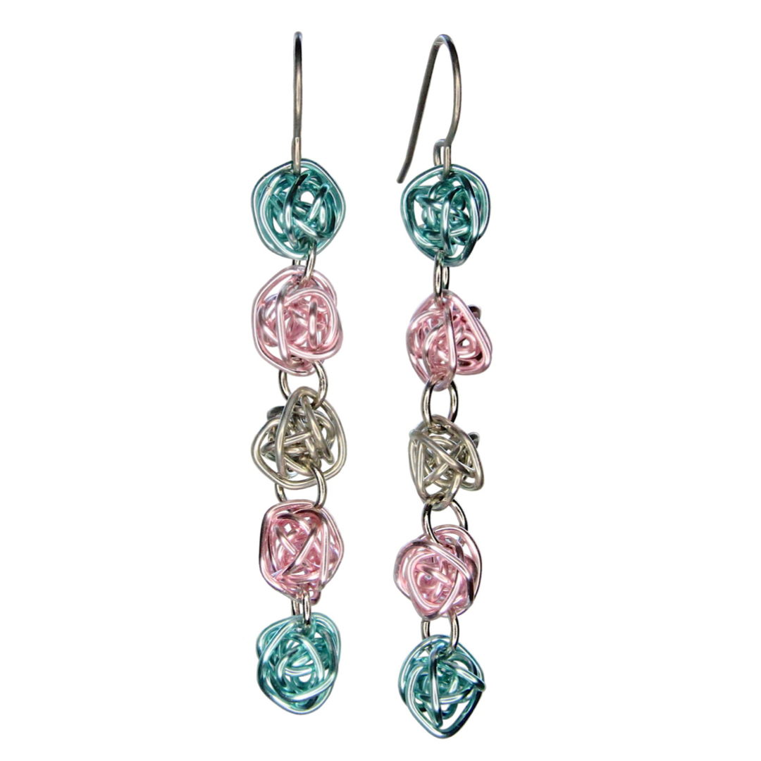 Each earring has 5 colorful loosely wrapped wire balls attached vertically by jump rings in order of the transgender pride flag - light blue, pink, silver, pink, light blue.