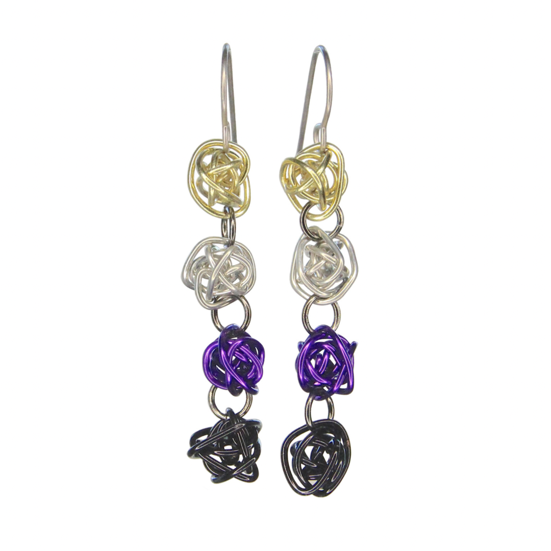 Each earring has 4 colorful loosely wrapped wire balls attached together vertically by jump rings in order of the nonbinary pride flag - yellow, silver, purple, and black. The wire is shiny and smooth