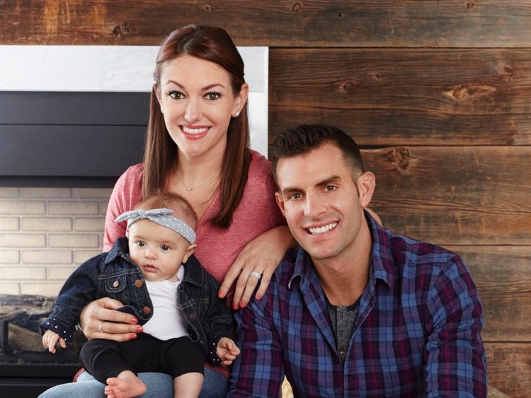 A family portrait of John with his wife Jennifer, and daughter, Lilyan Belle