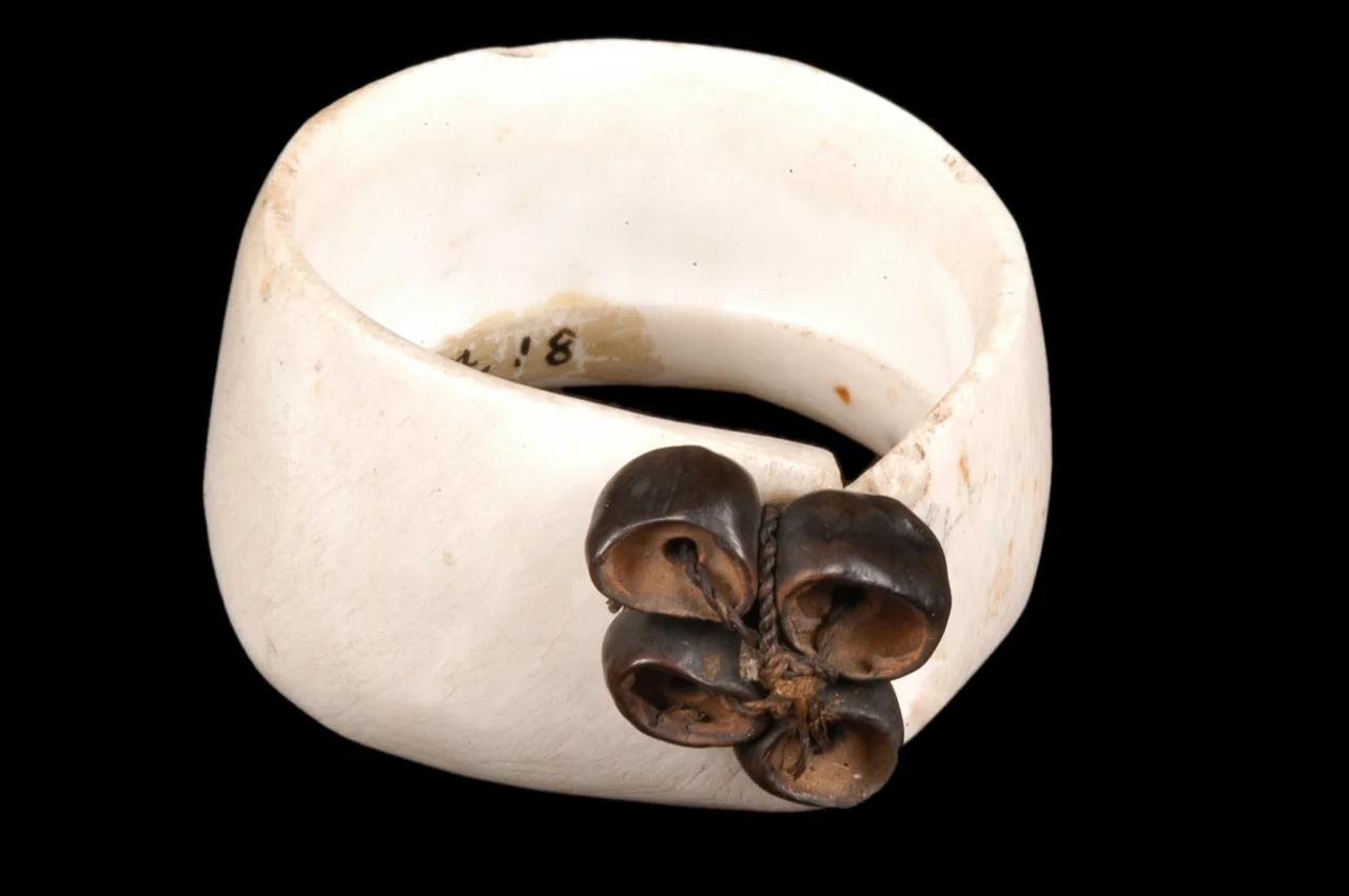  PAPUA NEW GUINEA  Mwali armband made from vegetal fibres, seeds and conus mille- punctus shell. Massim Region.Beginning 20th century&nbsp; 
