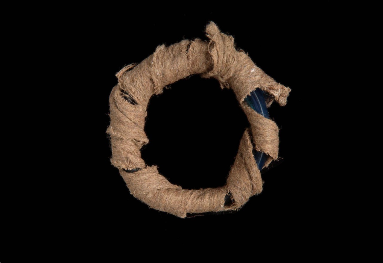  JAVA Glass bracelet wrapped in barkcloth used as ceremonial money. Found in West Papua New Guinea 