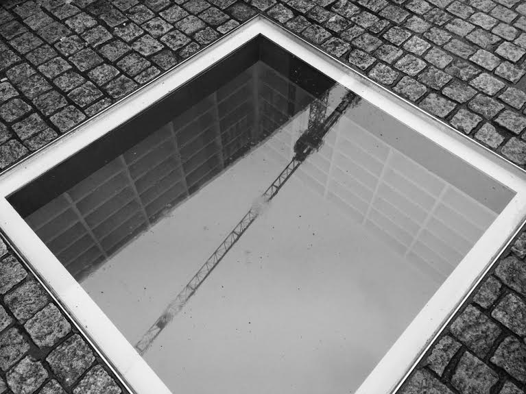 Nazi Book Burning Memorial in Berlin (reflecting nearby construction crane) Photo: Christine Schoefer