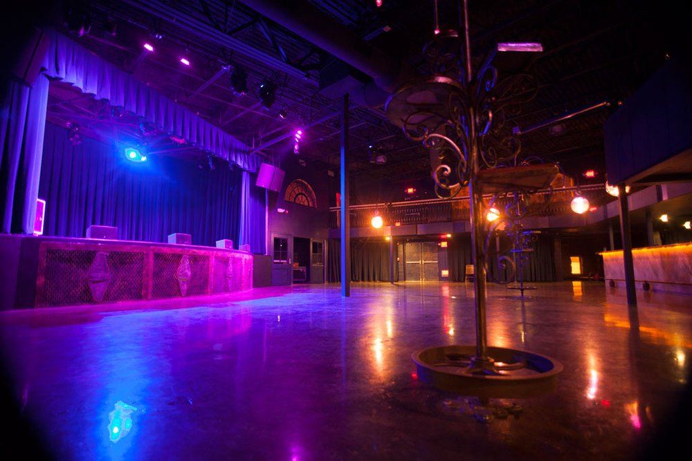 Purple and Yellow lights reflecting off of the Fete Music Hall's dancefloor