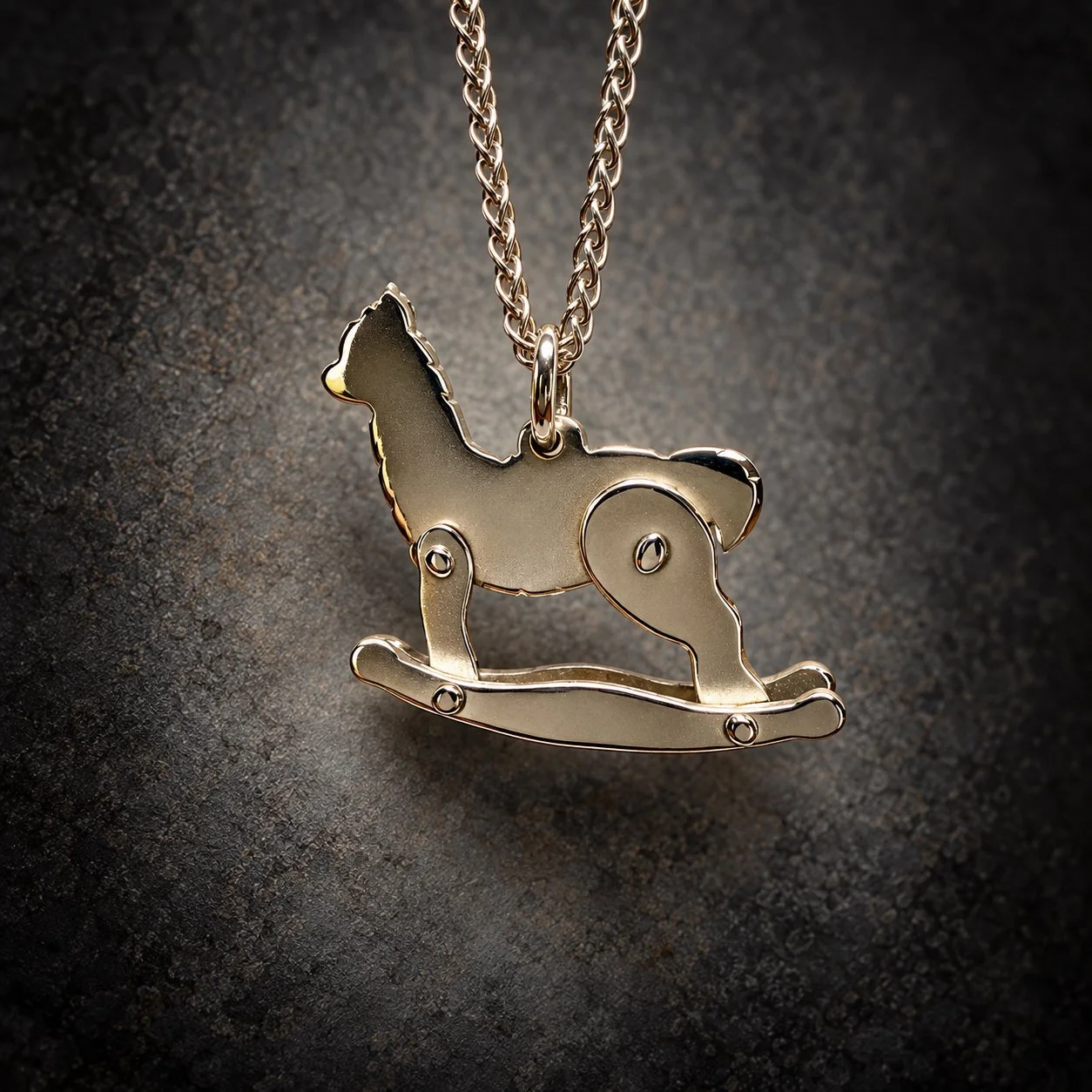 Rocking Alpaca sterling silver pendant showing handmade silver nail details and curved rockers