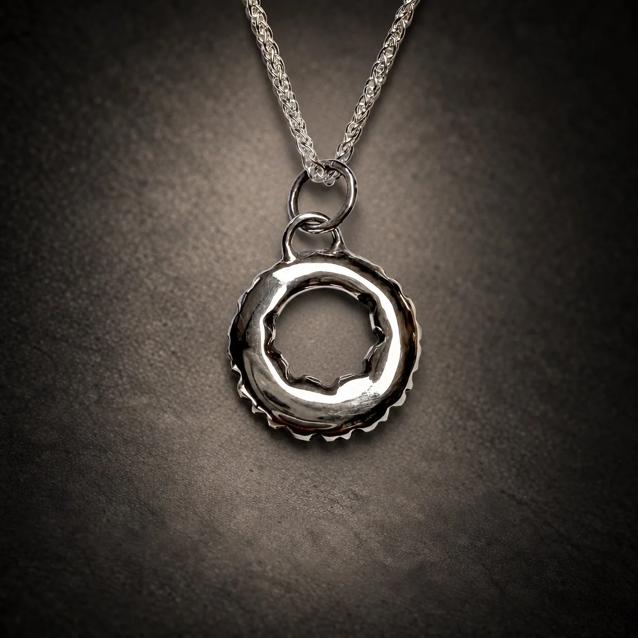 Leopard lichen silver pendant with oxidised spots, back polished view