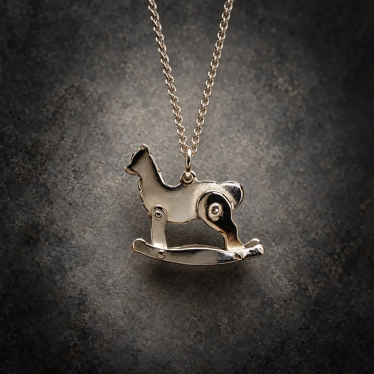 Handmade sterling silver Rocking Alpaca pendant on curved rockers, by Sue Thomas Creative
