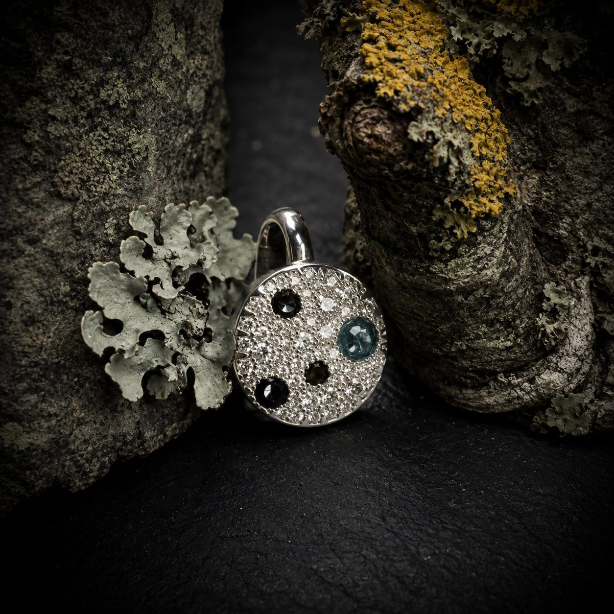 Enchanted Lichen Ring beside natural lichen on tree bark, showing the inspiration for the design