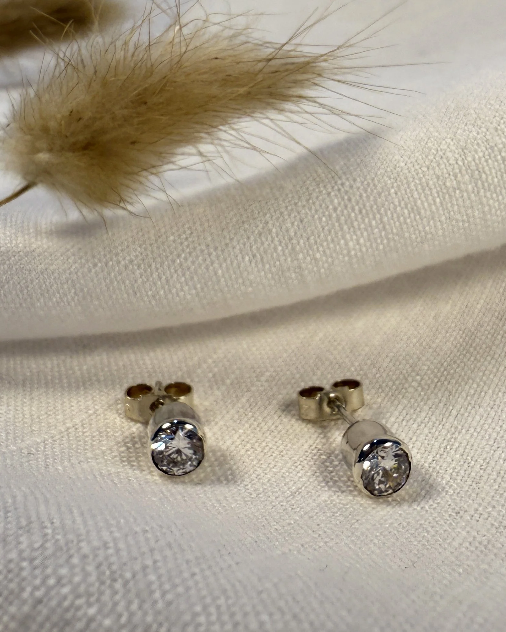 Silver stud earrings with a pop of sparkle