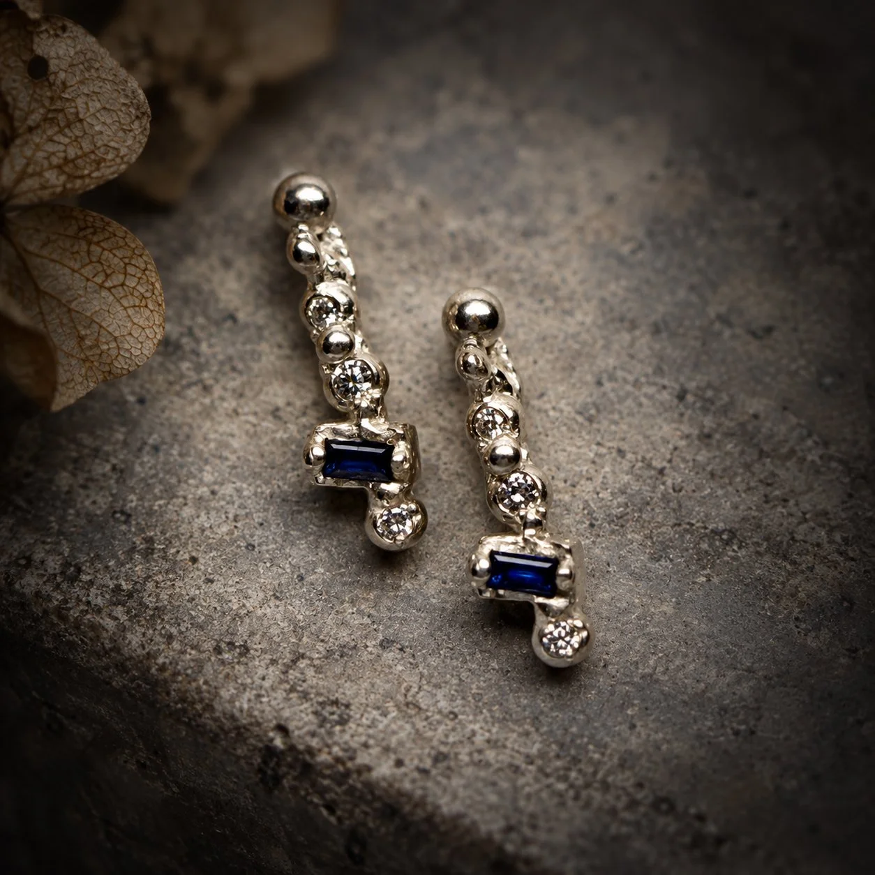 Sculptural silver Fragments earrings set with diamonds, moissanites and blue lab-grown sapphires