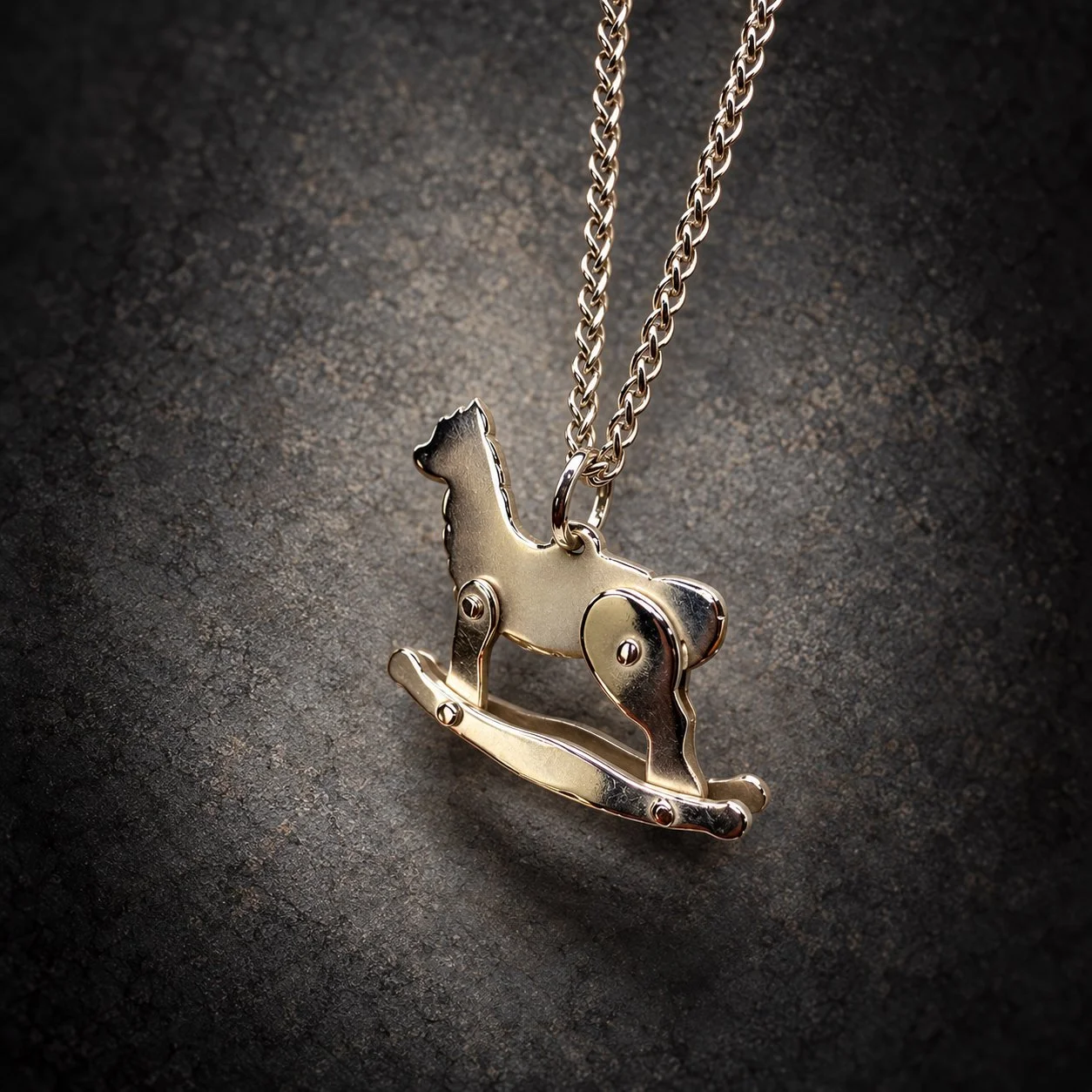 Handcrafted silver alpaca necklace inspired by a traditional rocking horse, by Sue Thomas Creative