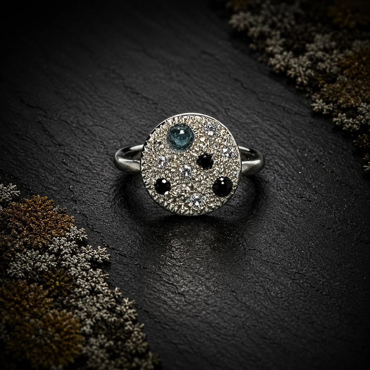 Front view of Enchanted Lichen Ring in sterling silver set with diamonds, tourmaline and sapphire