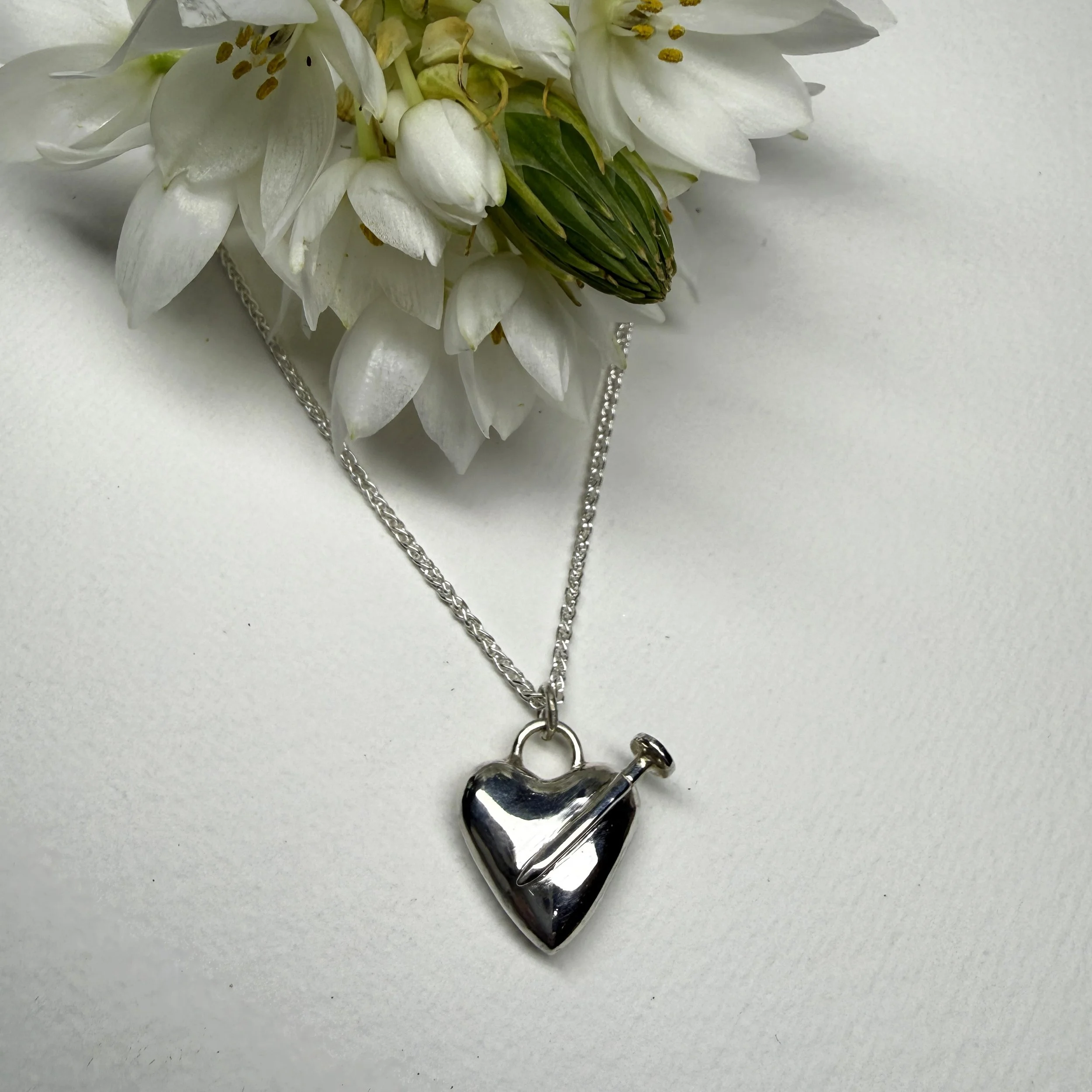 Nail in my heart silver pendant