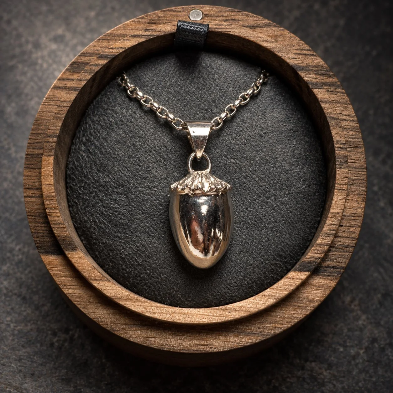 Sterling silver poppy pod pendant on 24 inch Belcher chain in handmade walnut jewellery box