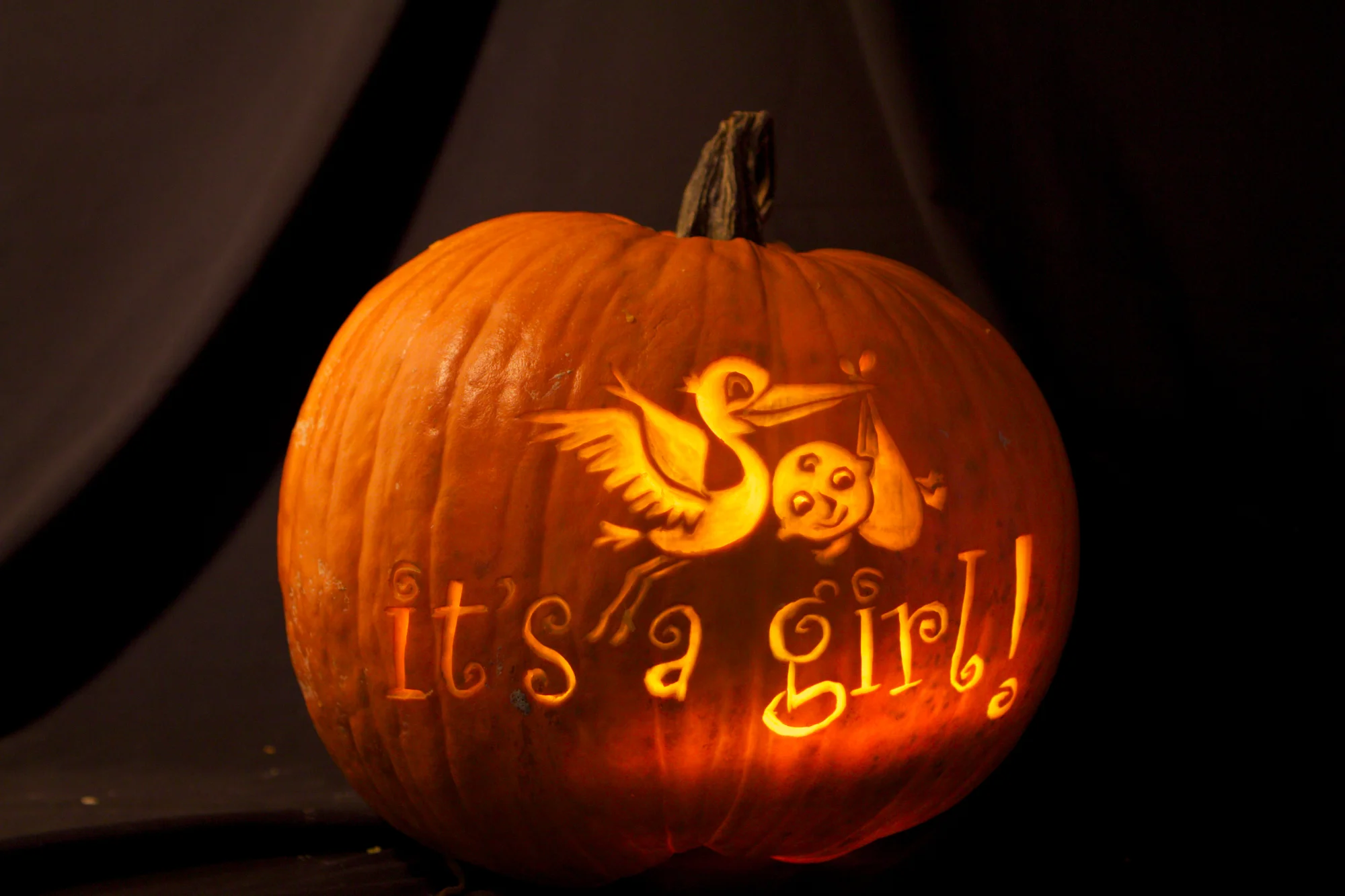 Large pumpkin with text and graphics.