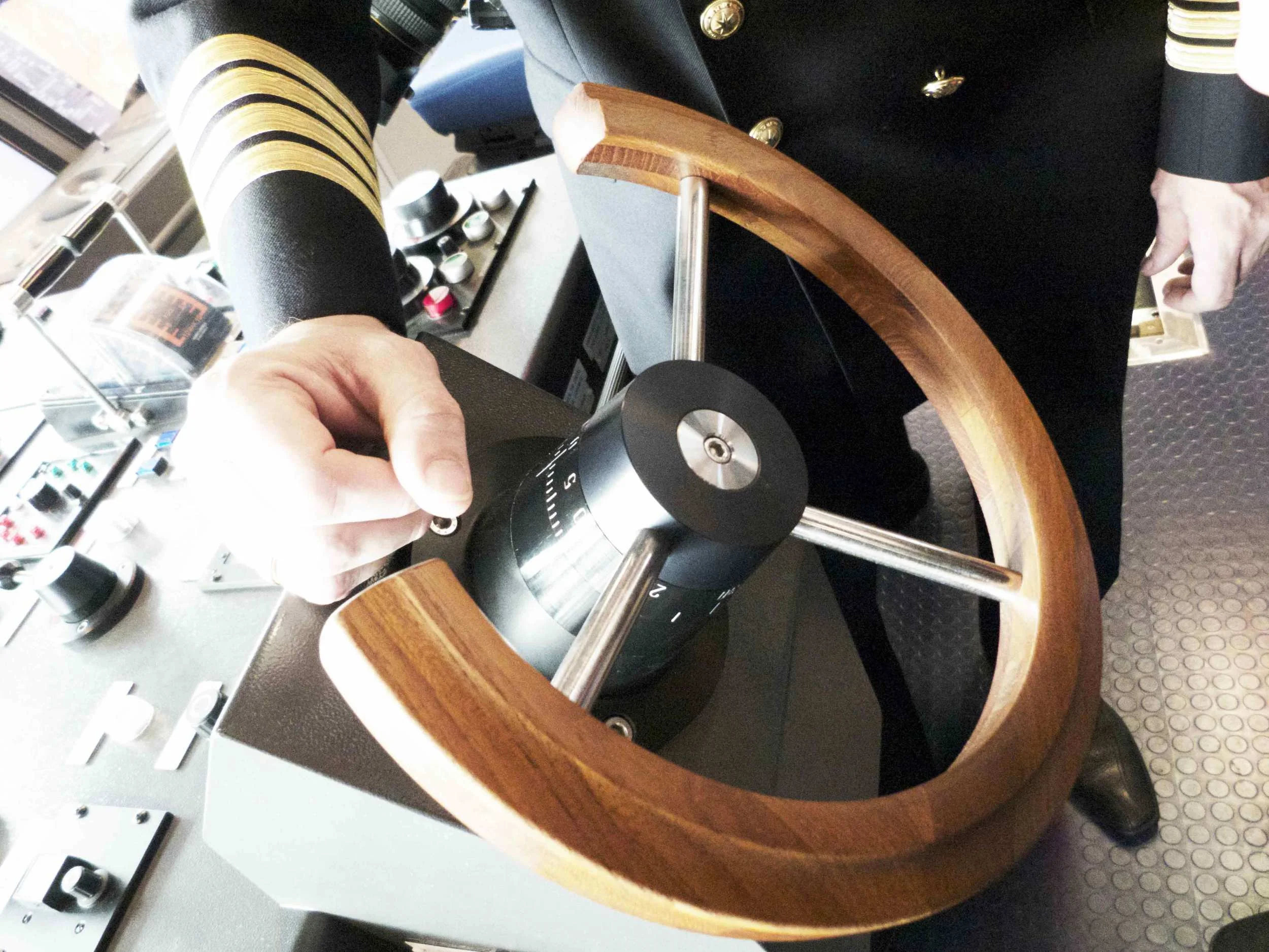 Modern super ships still have wooden steering wheels. This picture is from a MAERSK triple E class container ship. 
