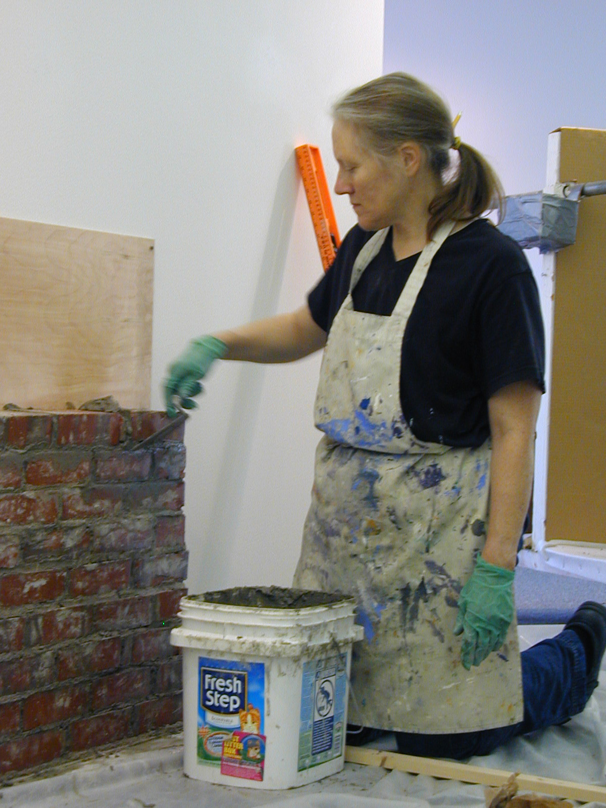 Maggie laying bricks for Memorial Wall to Colby Women, November 2006.