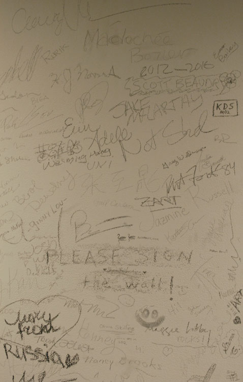 Museum goers' writing on wall, Hidden Histories exhibition, Colby Museum. 2012.