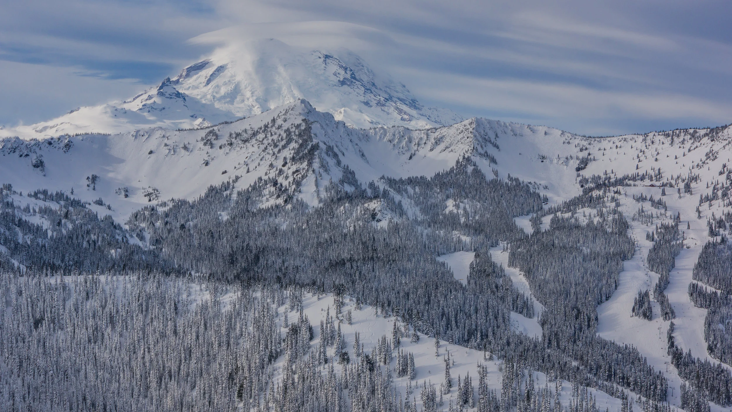 A lenticular cloud hovers over Mount Rainier.