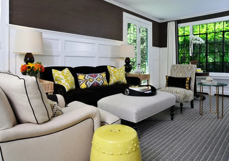 yellow ikat pillows - dark walls - wainscoting