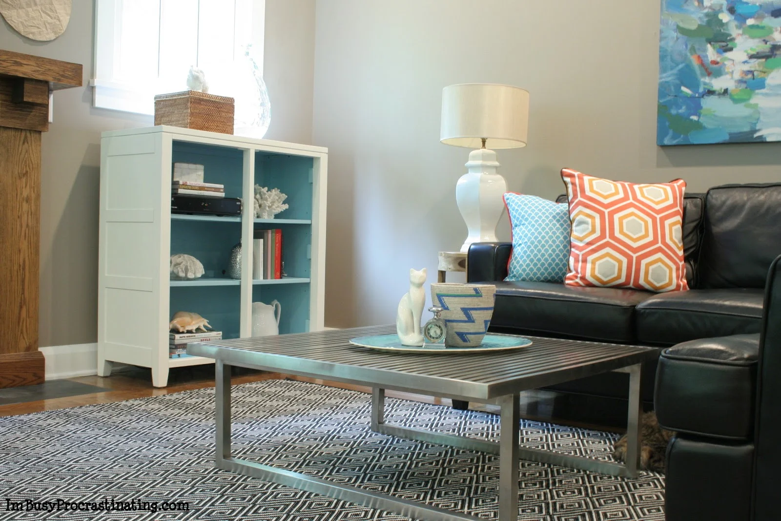 White & turquoise painted cabinet - living room view