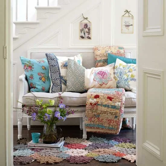 settee with pillows and colourful rug