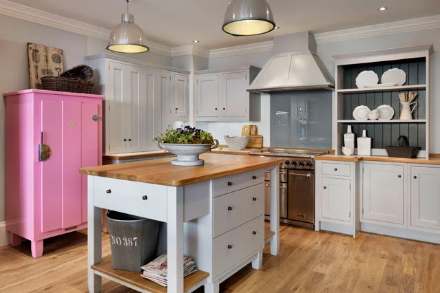 white kitchen with pop of pink