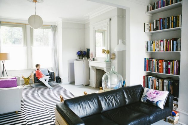 Love that this is a grand Victorian home with an Ikea rug and mismatched furniture