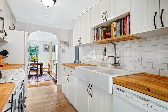 Combine butcher block with simple white cabinetry so that white appliances look intentional and beautiful.