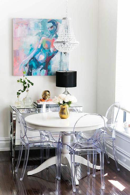 The Ingatorp table from Ikea has a hidden leaf right inside the table and sits four perfectly while round, and six with the leaf. Just $369 too!