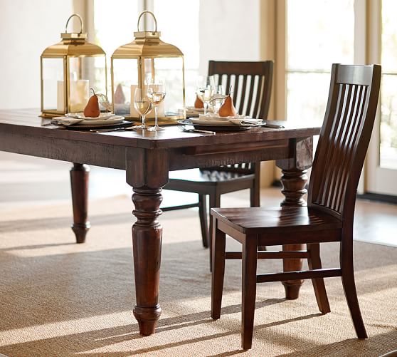  Pottery Barn's Sumner extension table has two leaves that attach to the ends so when not extended, there is no split down the middle. Consider pairing this solid table with some modern chairs for an eclectic look. 