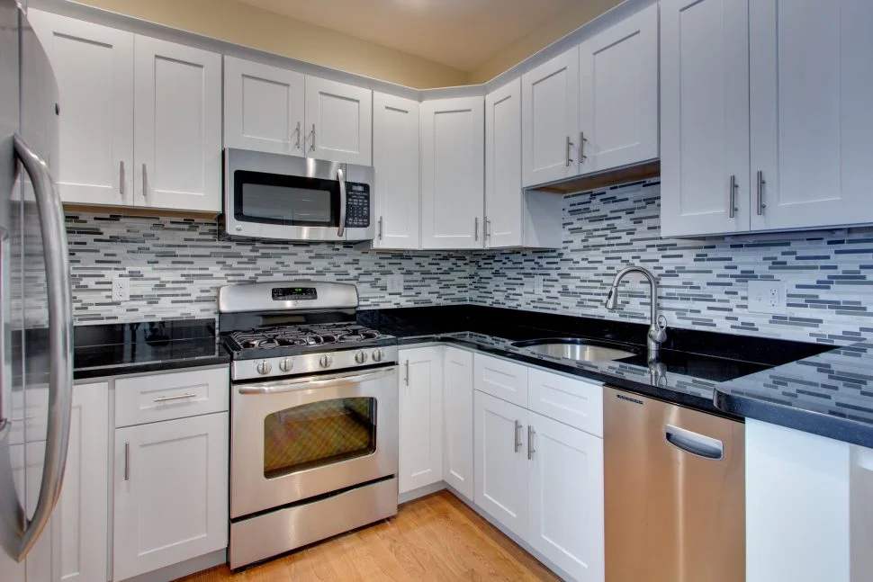 OUT - the narrow mosaic backsplash. It's just been around for too long and there are more exciting choices now.