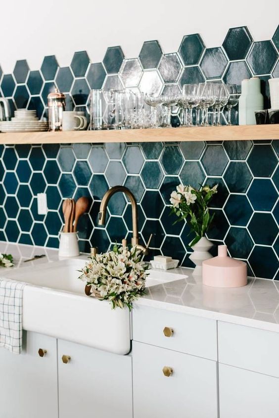  A quartz counter feels fresher and cleaner and allows for the backsplash to really shine. 