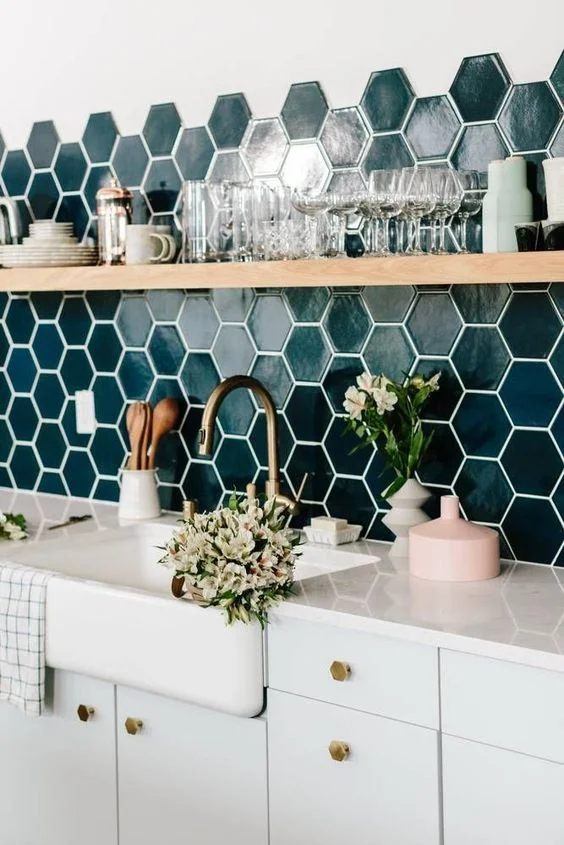 A quartz counter feels fresher and cleaner and allows for the backsplash to really shine.