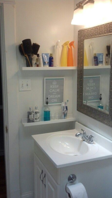 Inexpensive picture ledges are perfect for all the smaller items you store in your bathroom. Get creative and use them as display as well.