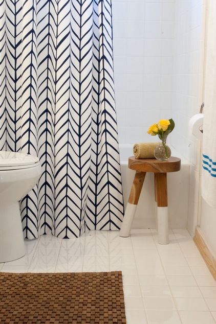 Add a stunning shower curtain and wooden mat to camouflage anything you don't like.