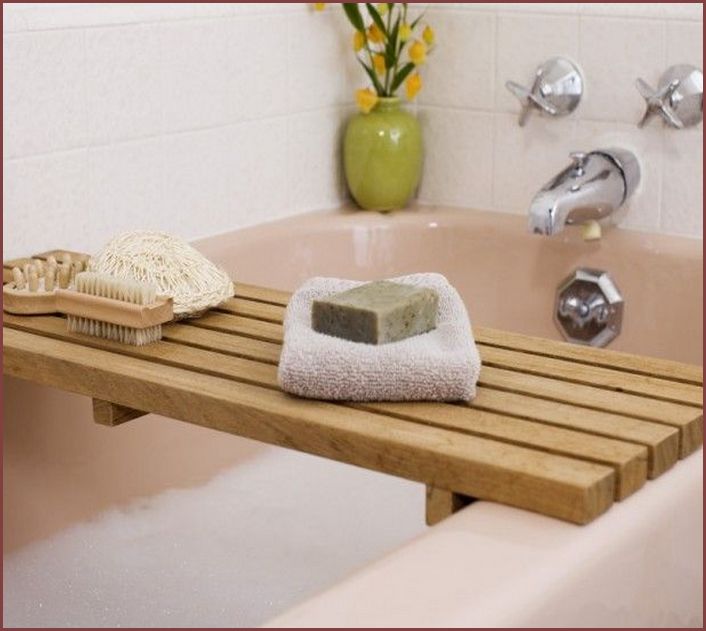 Even if you don't bathe often, a bathtub caddy is a great place to store your shampoos and adds that hit of warmth. Consider cedar wood for a fresh scent every time it gets wet.