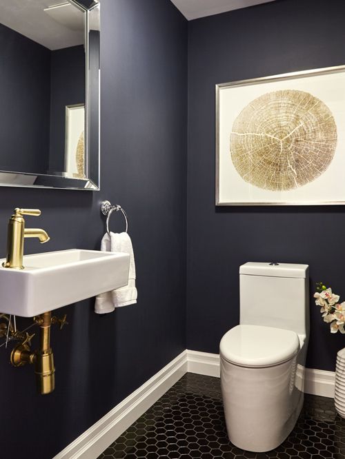 Simply paint the walls in your favourite deep colour and add a gold tap. Instant drama!