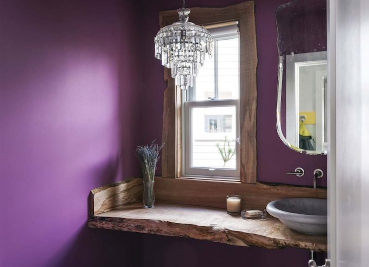 Be as eclectic as you like - here a vintage mirror and chandelier couples nicely with rustic wood and a marble bowl sink.