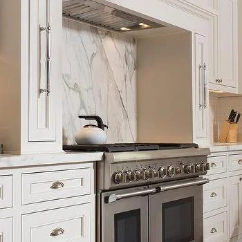 m_concealed-vent-hood-thermador-stove-pull-out-spice-rack-cabinets.jpg