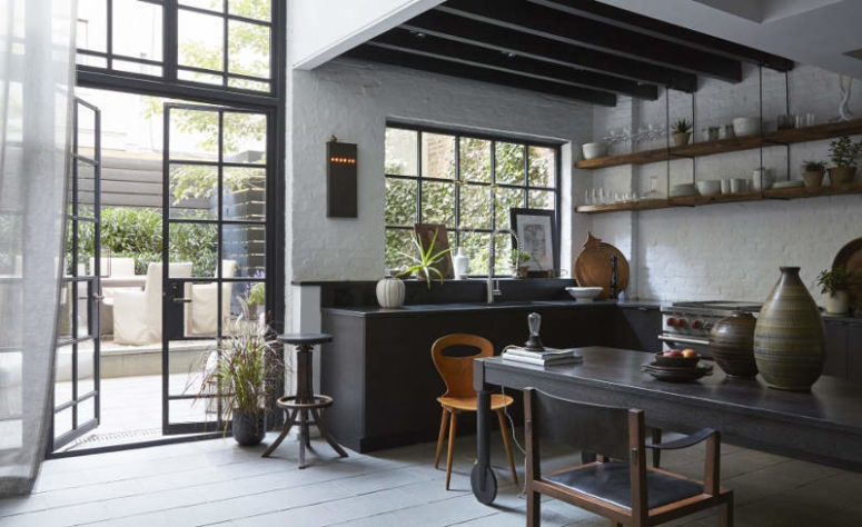 01-This-moody-kitchen-decorted-in-industrial-meets-vintage-style-features-a-classic-black-and-white-color-combo-775x474.jpeg