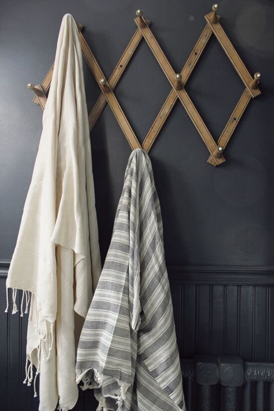 Turkish towels hung on hooks is a fresh and updated look