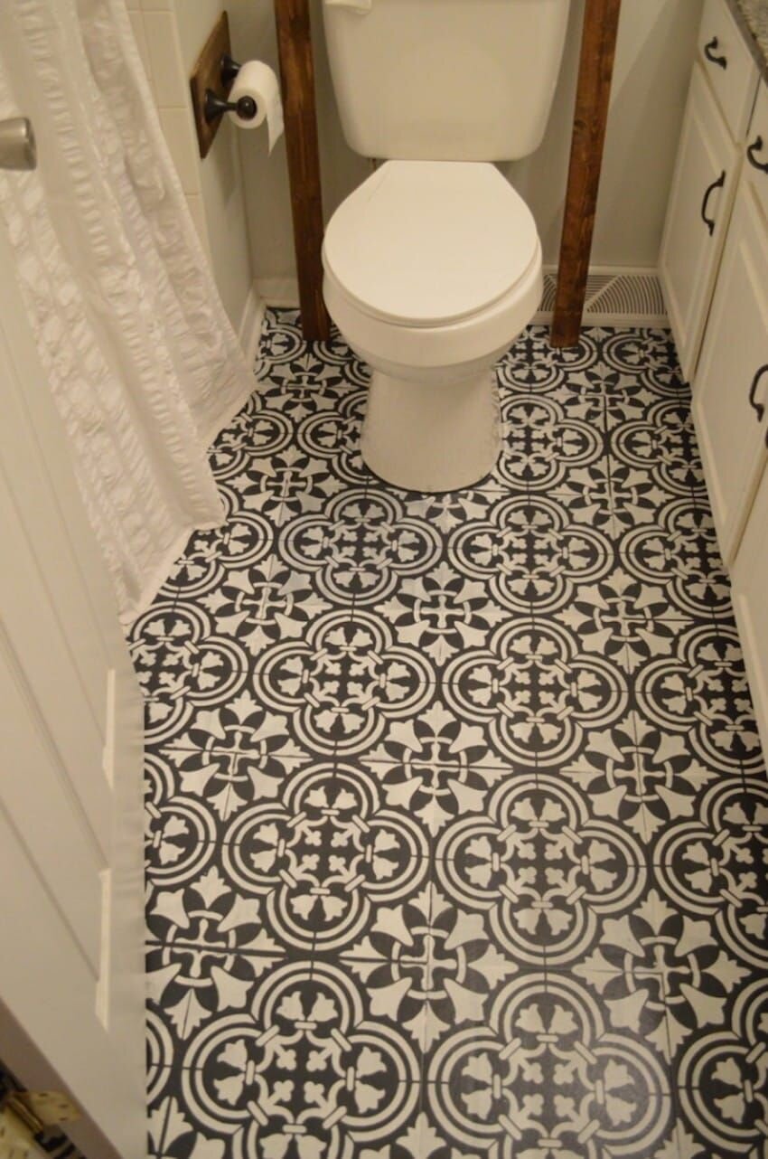 Inexpensive vinyl flooring can simply be cut to size and laid on top of almost any old tiles