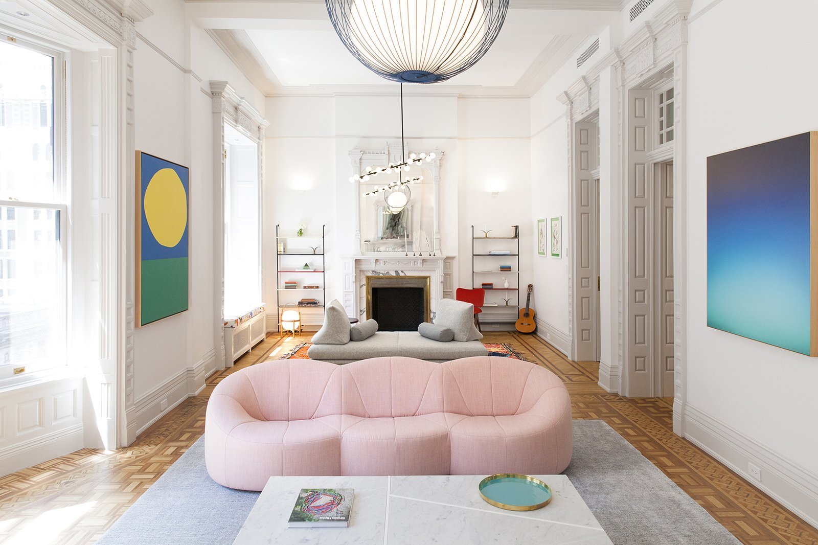 the-curvy-shape-of-this-pink-sofa-gives-it-a-fun-playful-quality.jpg