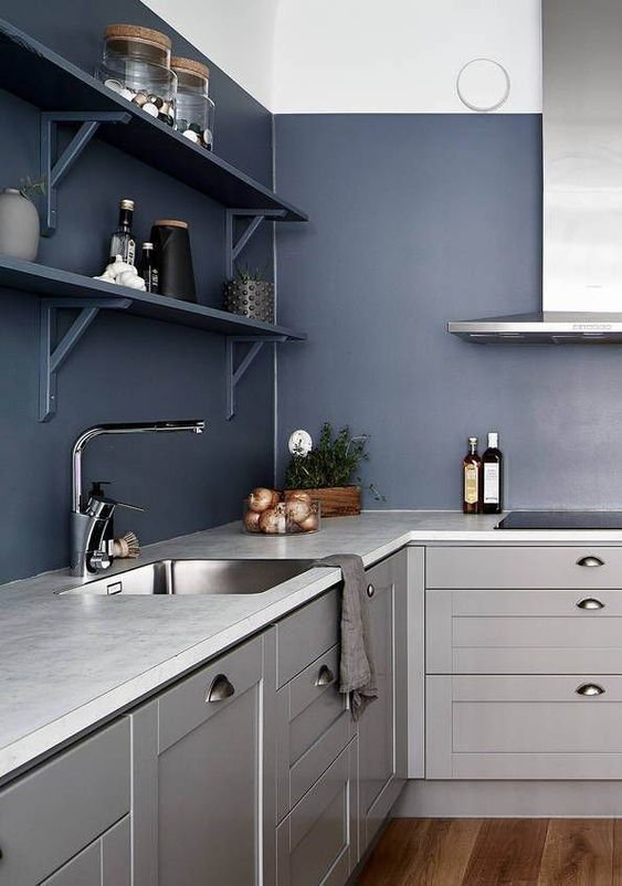 a-bold-contemporary-kitchen-in-light-grey-with-navy-walls-and-shelves-looks-ultimately-edgy-and-chic.jpg
