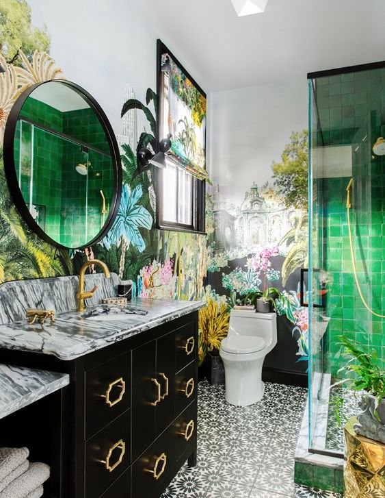 a-gorgeous-maximalist-bathroom-with-botanical-motifs-with-printed-tiles-green-ones-in-the-shower-bold-floral-wallpaper-and-a-black-vanity.jpg