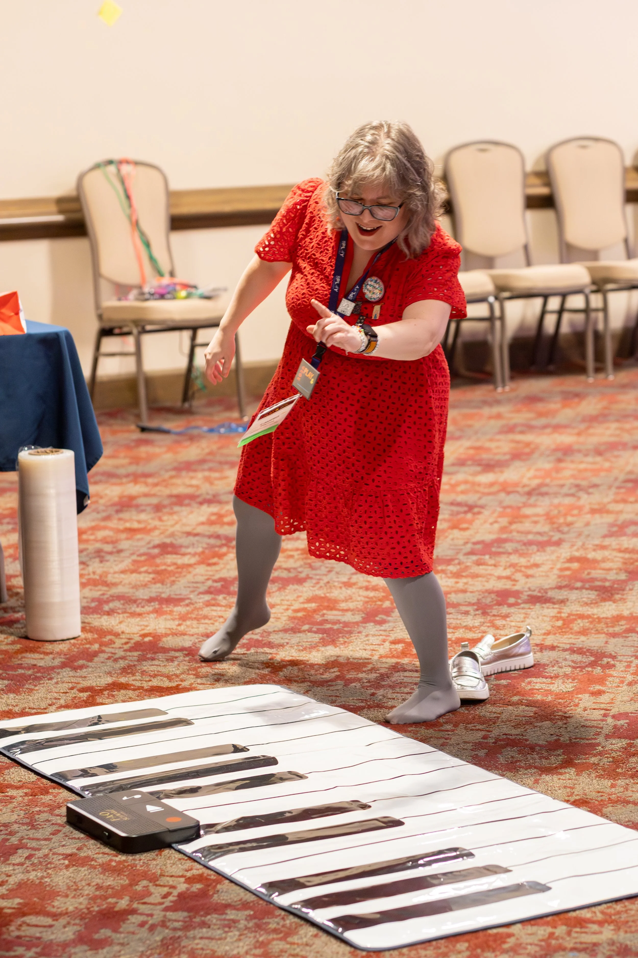 woman plays on floor piano