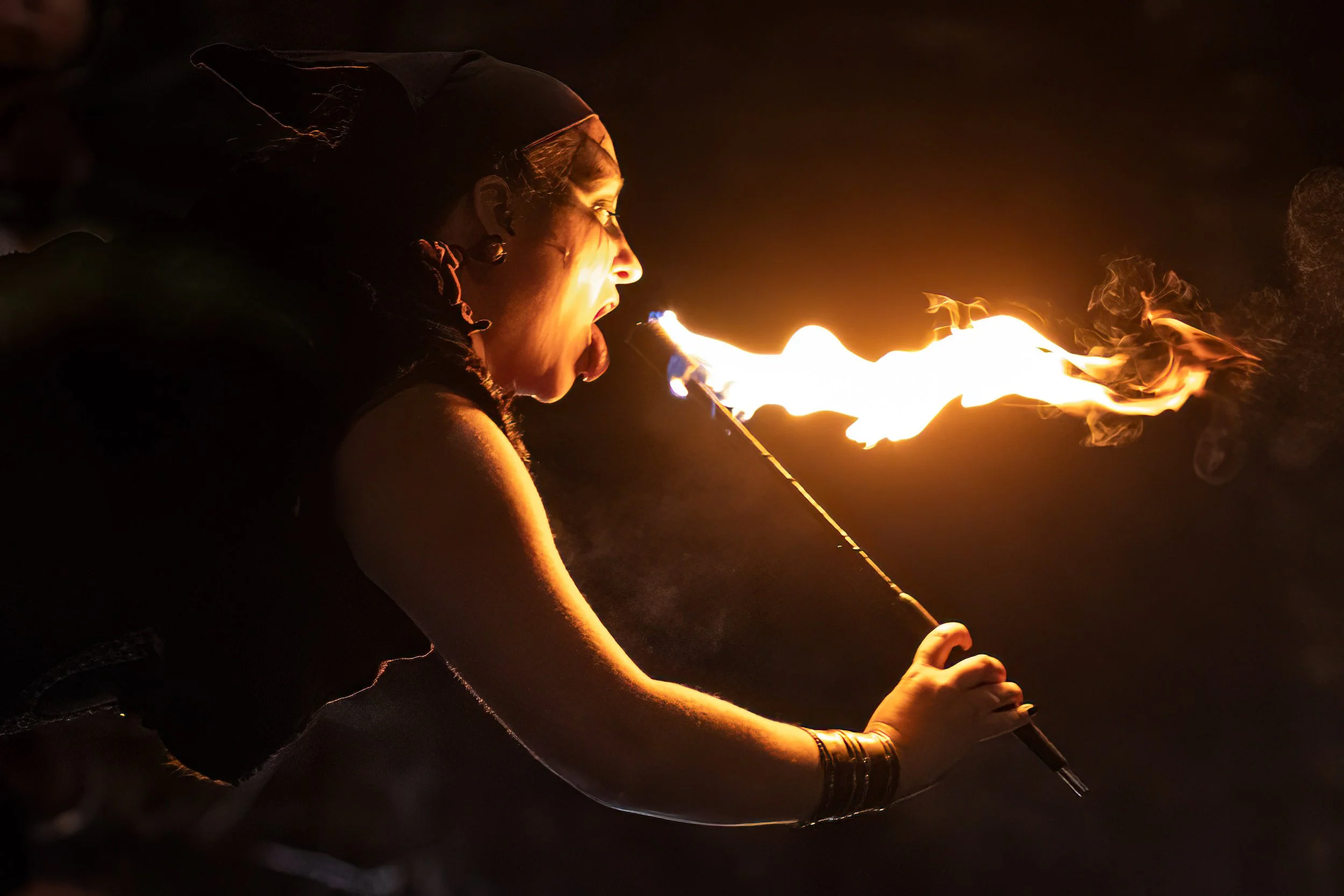 woman eats fire