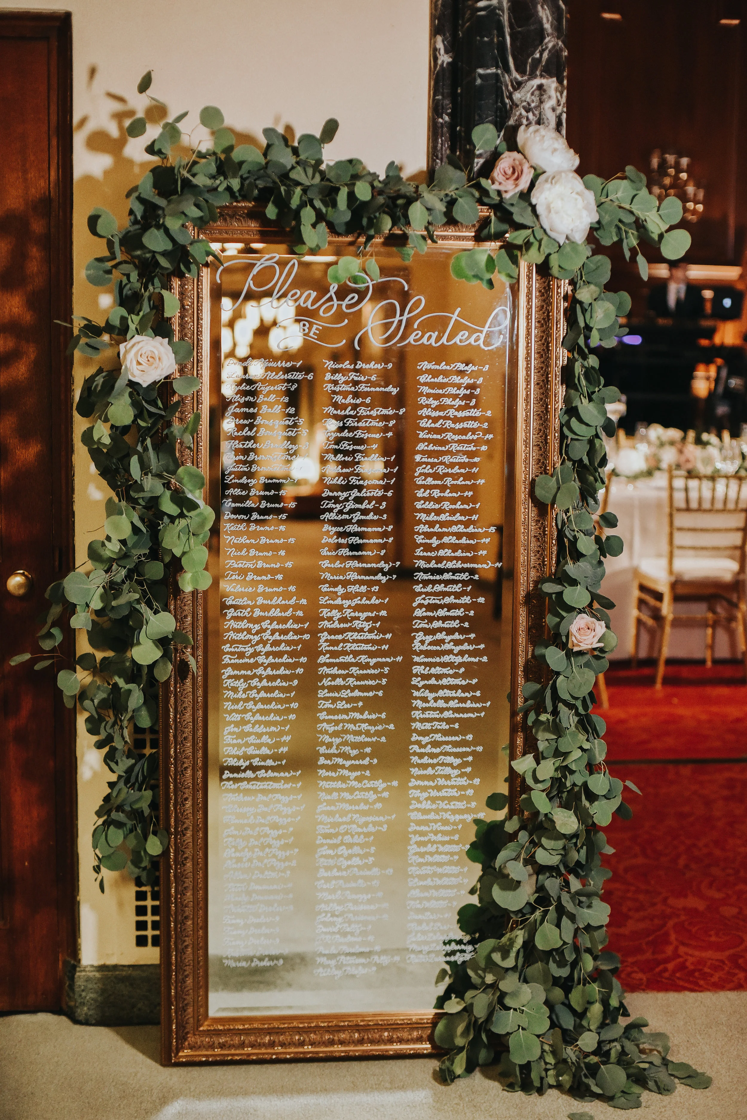 Los Angeles calligraphy on mirror seating chart